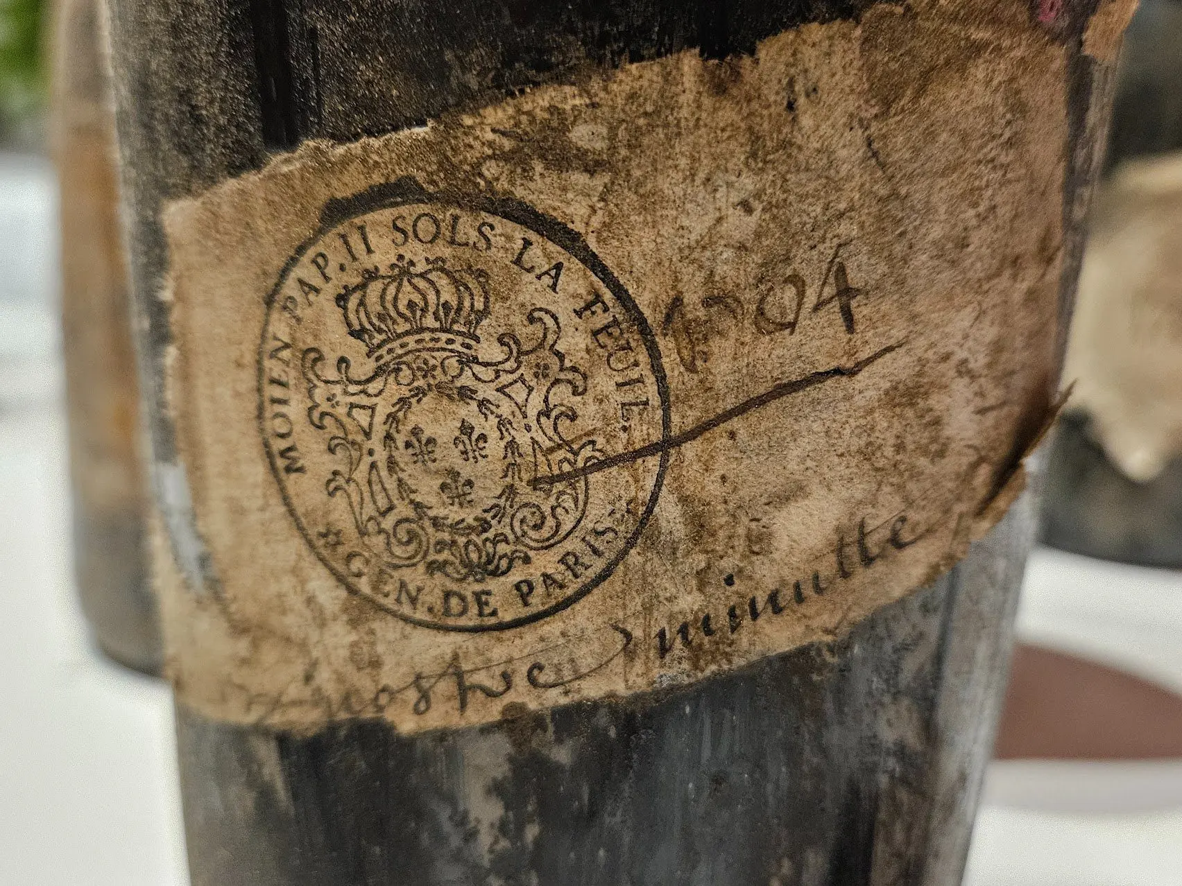 Bottle with stamped paper