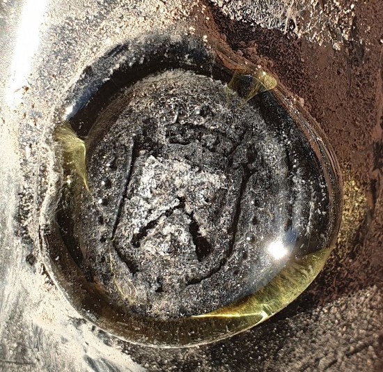 Applied glass seal seen close up