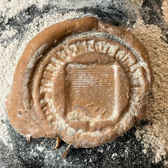 Wax seal with a shield in a lettered border, cord ends emerging below: the barry field of the historical coat of arms of Abaúj-Torna county