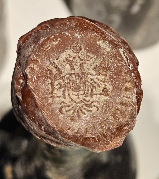 Wax seal on the cork, impressed with a crowned armorial device