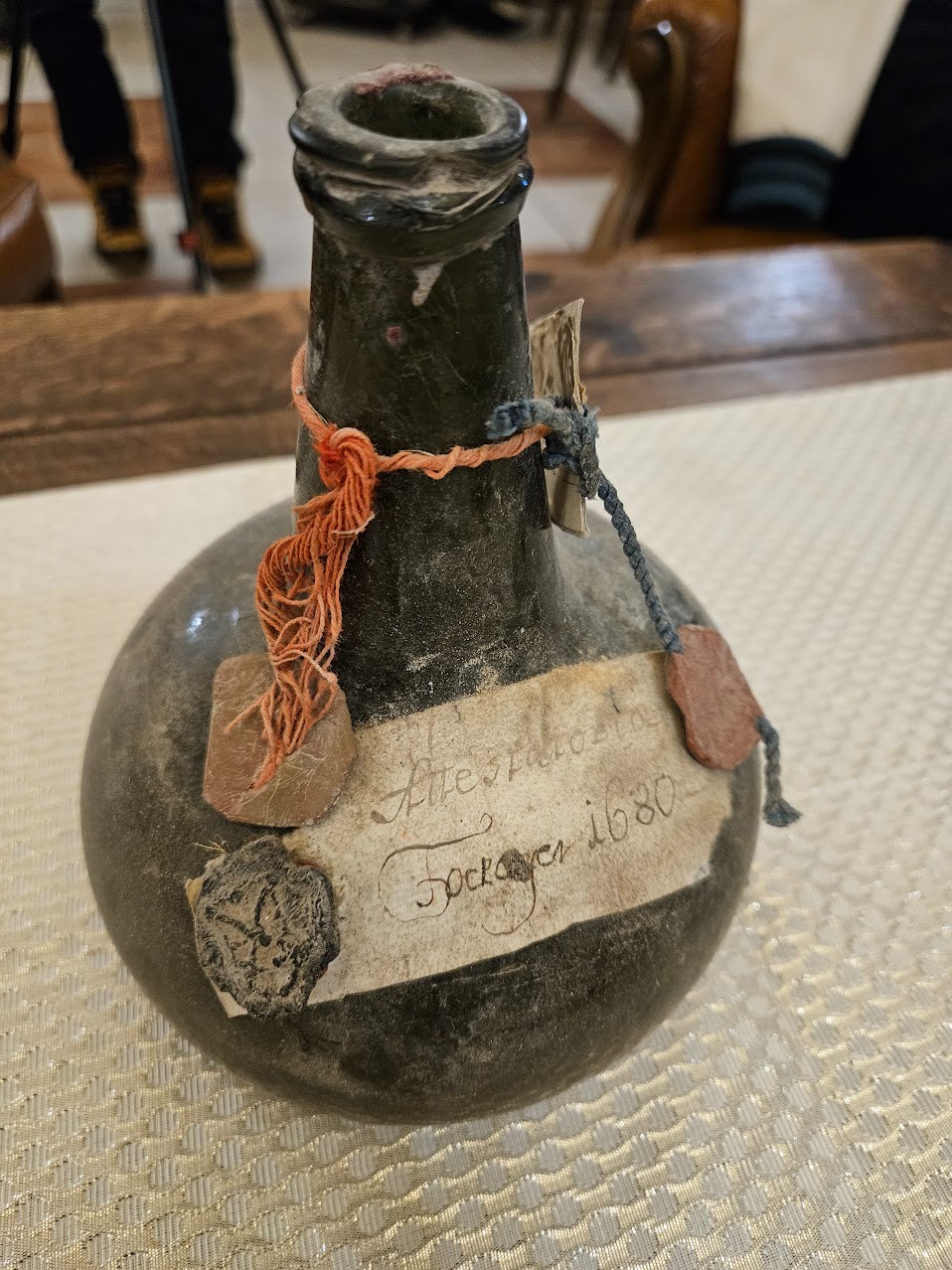 Onion bottle inscribed Tockayer 1680, held by three separate wax seals over cord and parchment