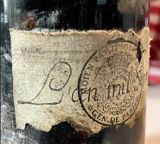 The stamp in raking light, MOIEN PAY II SOLS and GEN. DE PARIS around the crown, the handwritten date crossing the impression