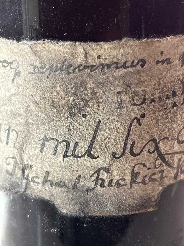 The label: “mil six…” and “Michal Fuckier”