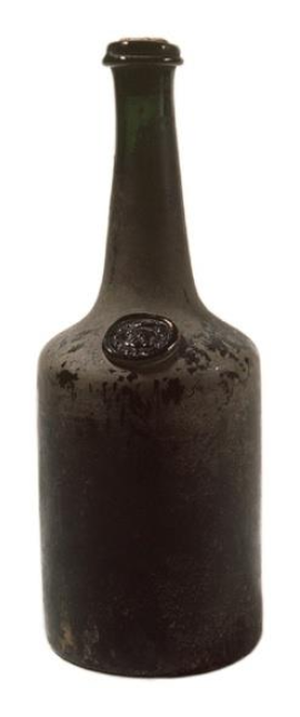 A dark green pear-shaped bottle with a glass seal on the shoulder