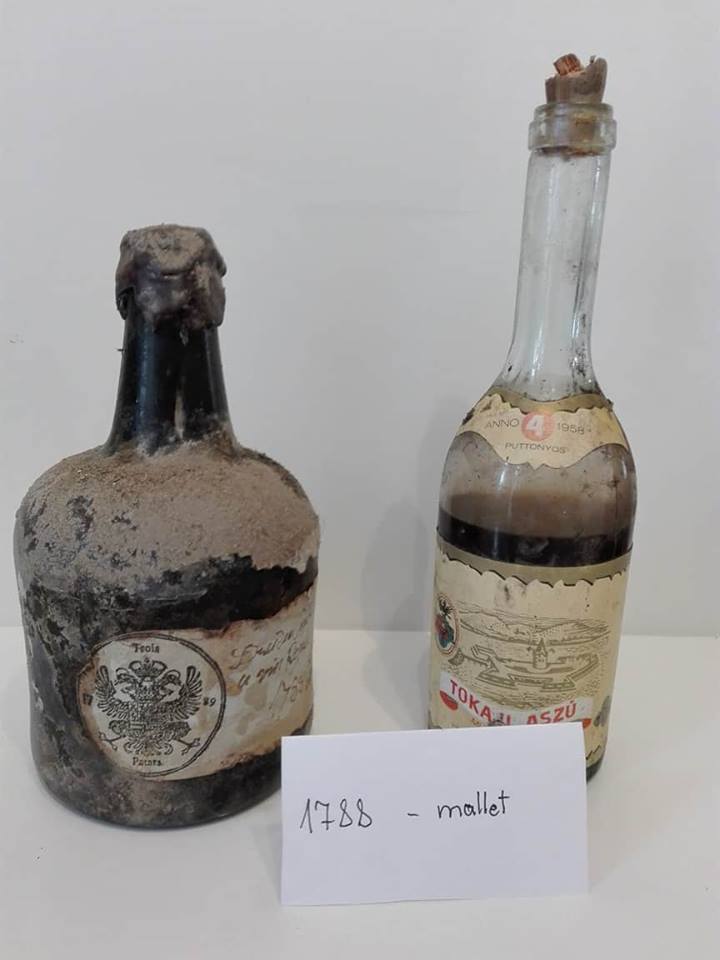 The label: printed TROIS PATARS roundel with crowned double-headed eagle, and the manuscript inscription