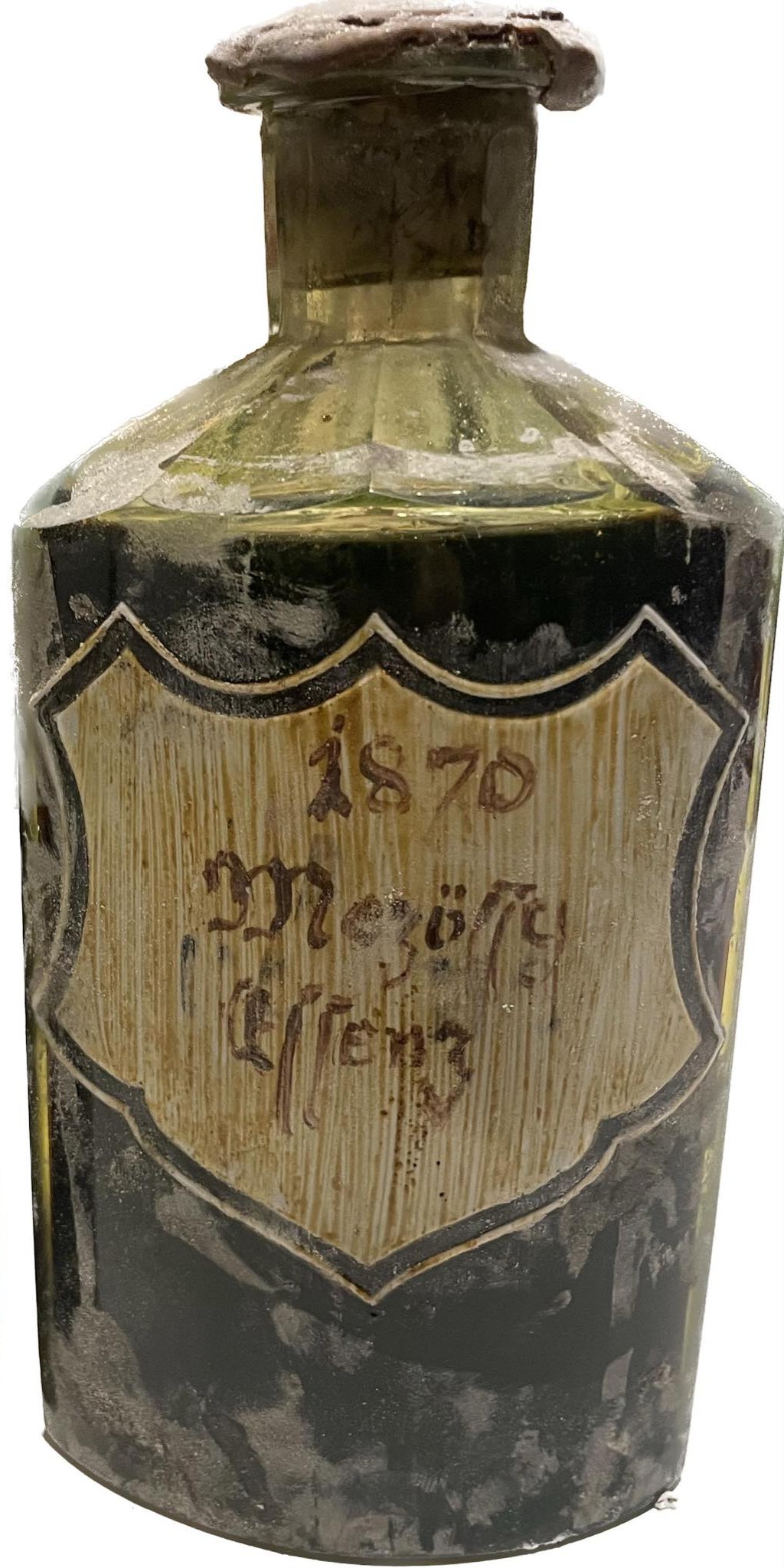 The 1870 Mezőssy Essenz bottle in uranium glass, shield label painted on the glass