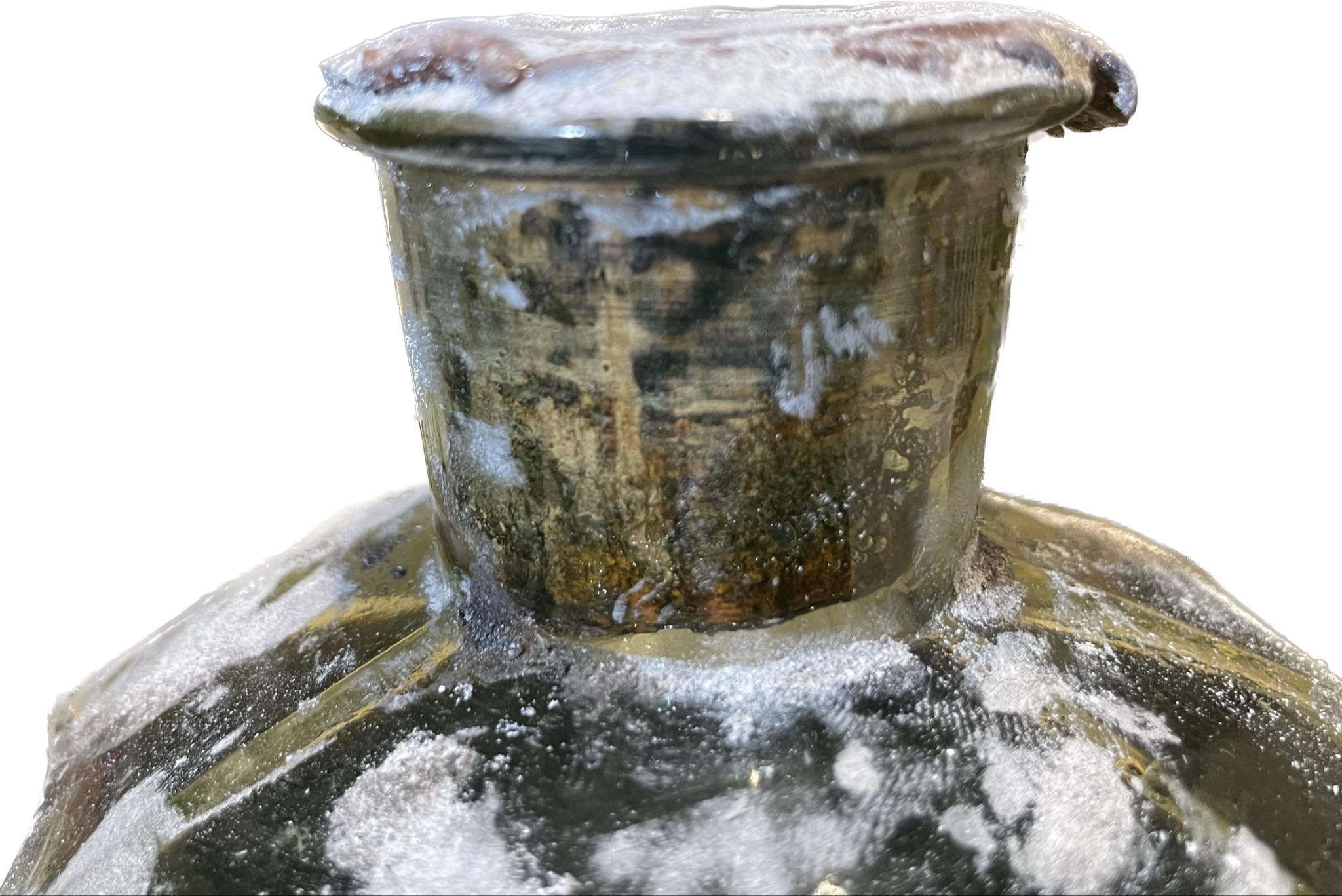 The neck and wax-sealed cork of the bottle
