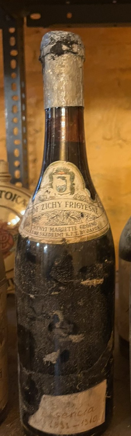 The Zichy Essencia bottle, printed shoulder label and handwritten paper band at the base