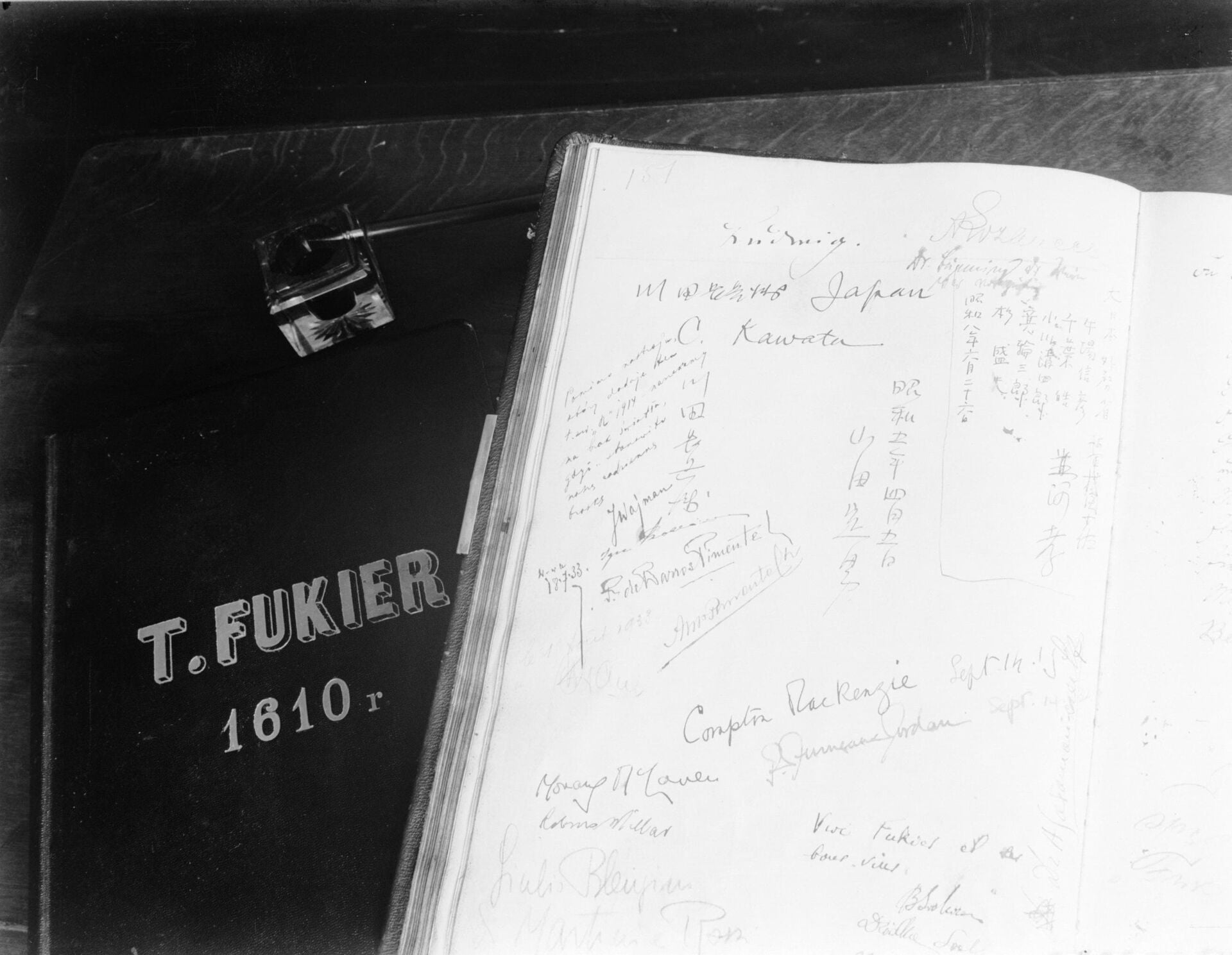 Willem van de Poll's 1934 photograph of the open Fukier guest book, the signature Ludwig at the top of the page