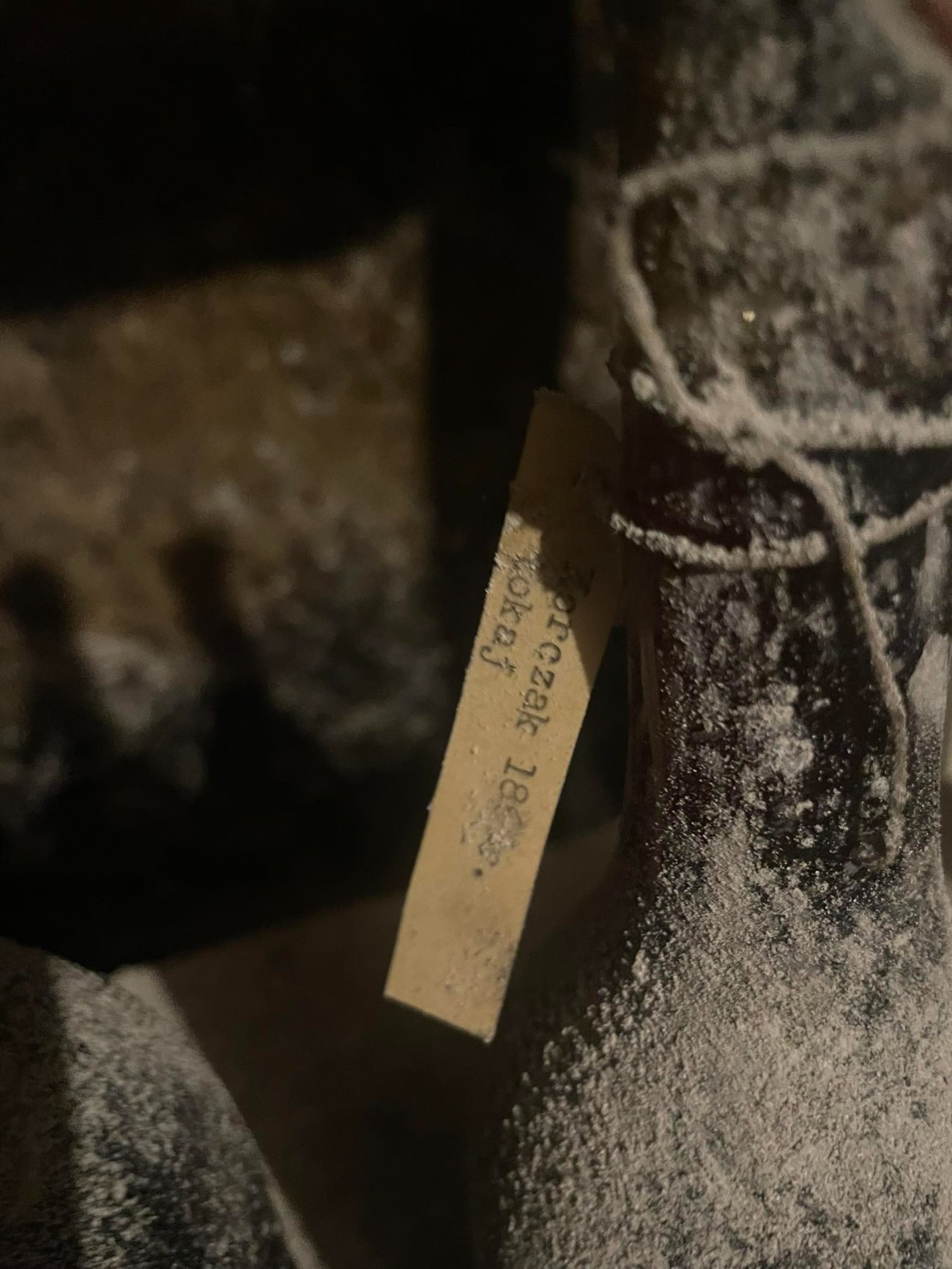 Cellar tag reading Korczak, tokaj, with a date beginning 18