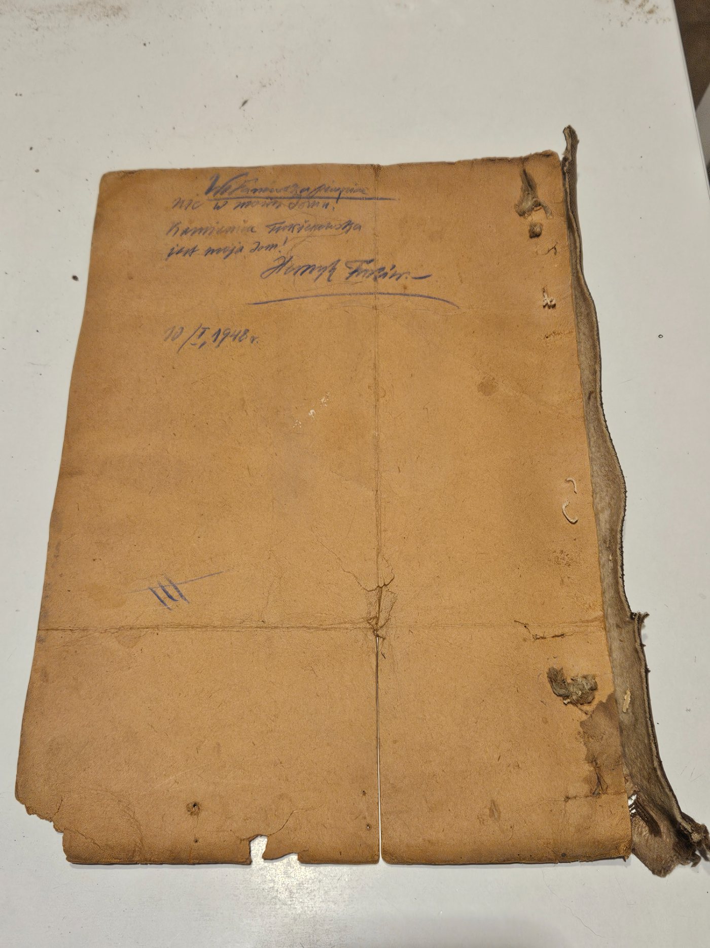 One face of the vellum wrapper, inscribed in pencil about the Fukier cellar, signed Henryk Fukier and dated 10/I 1948