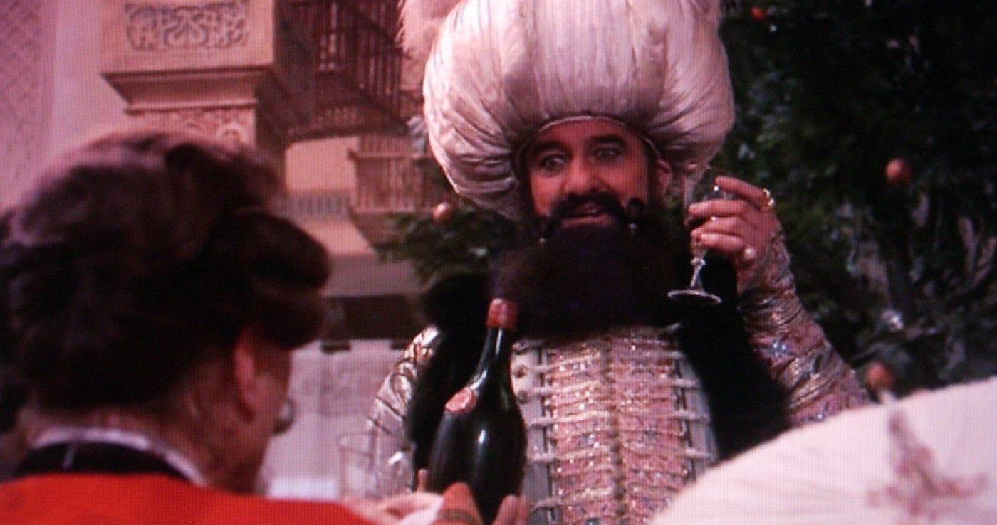 The Sultan with glass and bottle in Terry Gilliam's film, 1988