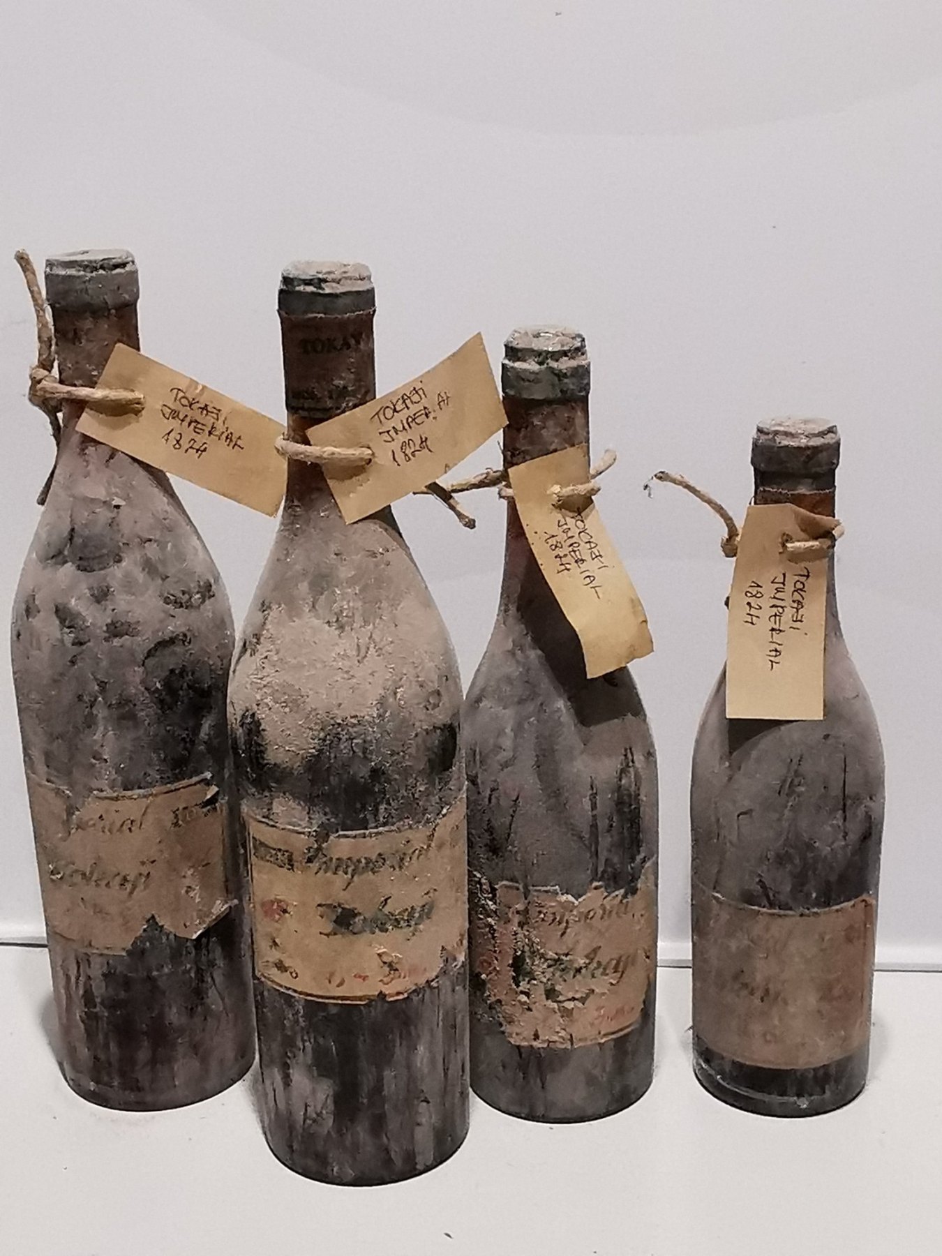 Four bottles labelled Imperial Tokay, tagged Tokaji Imperial 1824