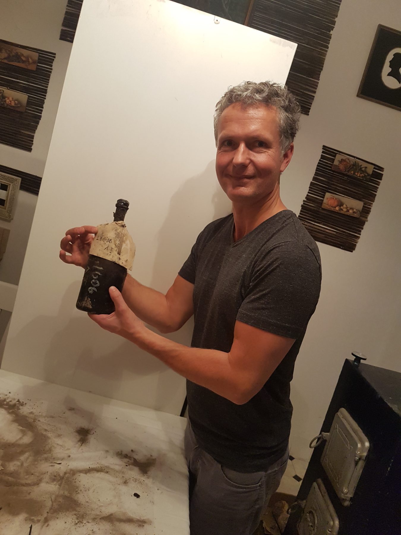 Holding a very old Tokaji bottle with wax seal and hand-written capsule