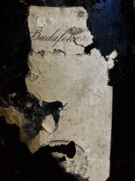 Torn paper label inscribed Budafokon