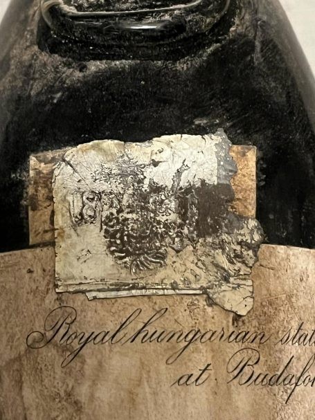 Foil seal above a Royal Hungarian State Cellar label