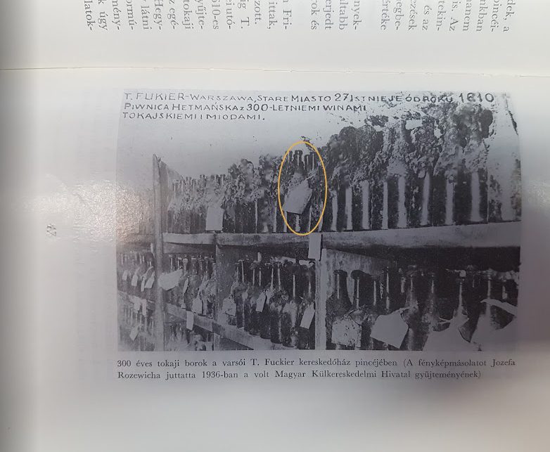 The Fukier cellar photographed for the house, with its own caption naming the Piwnica Hetmańska; one tagged bottle marked