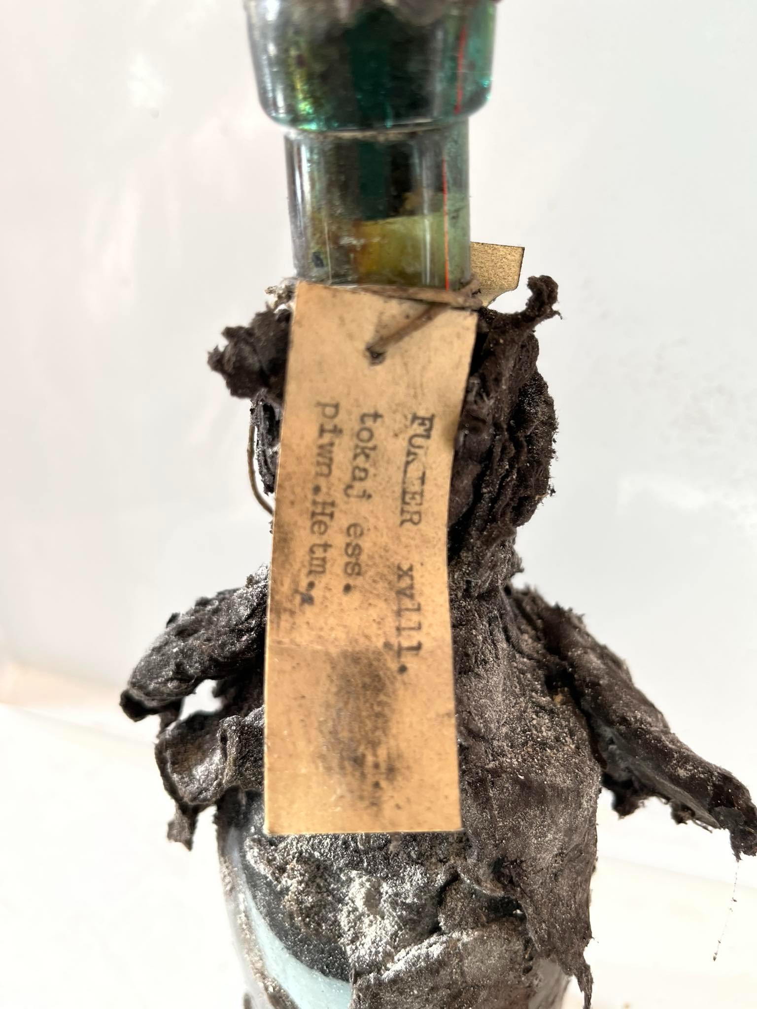 A 1668 Tokaji bottle carrying both the Fukier and the Tarasiewicz paper strips