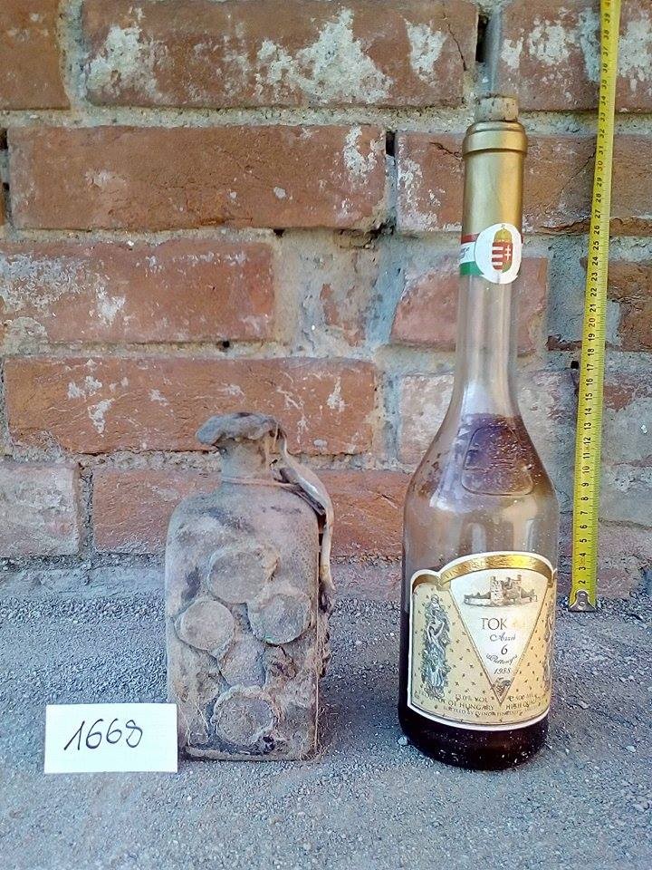 The 1668 bottle beside a modern Tokaji bottle for scale